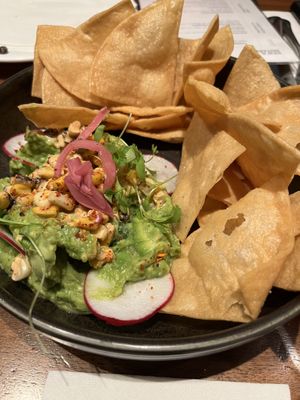 “Street corn avocado dip” = guac with corn on top for more money than just guac.   at Earls Kitchen + Bar in Toronto