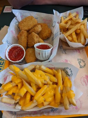 Nuggets, cheese fries, and normal fries in the back at The Sunny Burger Co. in Amsterdam