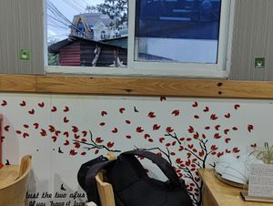 HappyCow stickers on the wall at Tu Sen in Da Lat