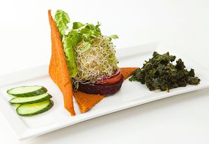 Seasoned Burger w/ Homemade Ketchup, Mustard and Mayo. Saved with choice of salad, kale chips or baked fries. at Plaanta in Bangkok