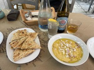 Pita bread with traditional hummus-like dip   at Mpakalógatos in Naxos