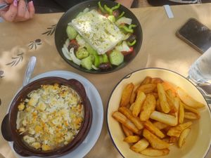 eggplant dish, greek salat, fried potatoes at Mpakalógatos in Naxos