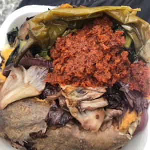 Jacked potato with dried tomatoes and vegetables   at Poormanger in Milan