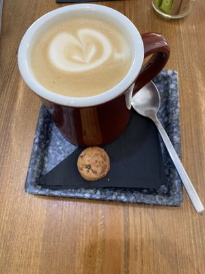 Oat latte - with non vegan cookie piece 🙁  at Monk Coffee in Rhodes