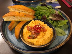 Our own red pepper hummus, dressed salad and homemade garlic and chilli
flatbread. at Edinbane Inn in Isle Of Skye