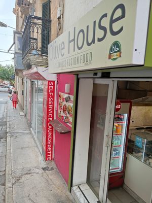 One small step in a side street from the main promenade in Sliema's southeastern shoreside, small entrance at Olive House - Maybe closed in Sliema