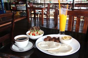 Catfish falafel plate includes ingredients for two pita falafels. The salad could be bigger and the portion could include some tomato sauce for moisture, but otherwise this is great.  at Catfish Book Cafe in Koh Lanta
