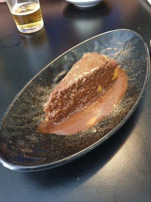 Orange spelt cake covered in chocolate sauce at La Cuina del Cel in Mataro