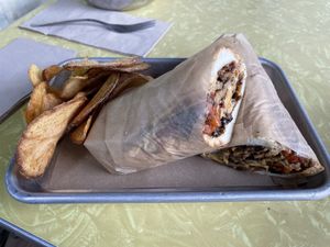 Philly cheesesteak with homemade russet potato chips  at The Green Beautiful  in Manchester