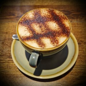 Cappuccino with vegan chocolate and oat milk at Sociale Cafe in West London