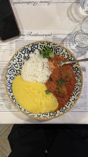 Vegan meatballs with rice + garnish of polenta (asked them to make it with water)  at Snow Restaurant in Sinaia