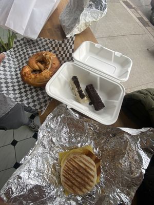 Cheese pretzel, kit kat and breakfast sandwich  at Aunty Em's Deli & Coffee in Toronto