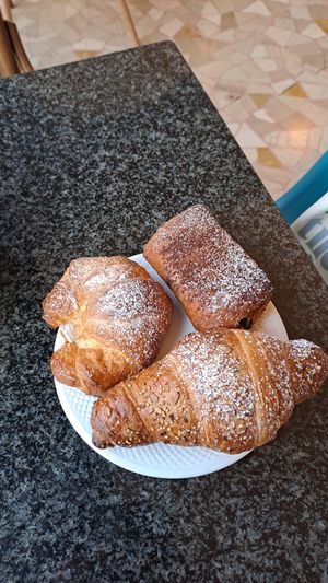simple croissant, one with chocolate filling and the other with orange cream. All amazing! at Costadoro Coffee Lab in Turin
