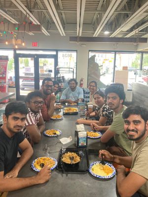 A group of students eating veg biryani at Saffron Indian Cuisine in Tampa