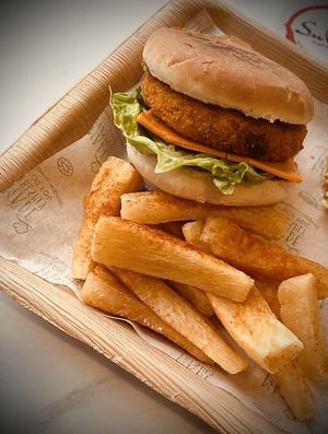 The Tikki Burger and Cassava Chips   at SuRano Plant Based Indian bistro in Beeston
