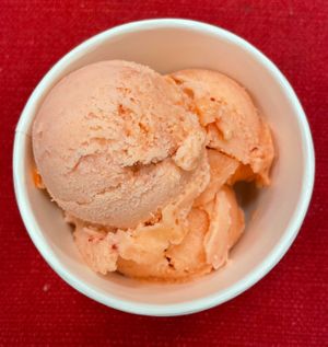 3 scoops of orange passion ice kream. Orange extract, guava pulp and strawberries.  at Scoops and Mini Desserts in Lawrenceville