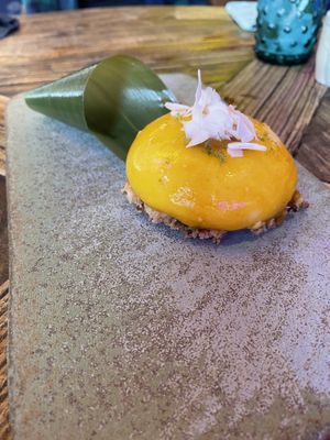 Delicious toasted coconut and mango/passion fruit dessert   at Desoriente - Poblenou in Barcelona