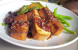 The tofu entree - Korean BBQ sauce on top of the tofu with coconut sticky rice and seasonal vegetables (garlic green beans) at Stonecat Cafe in Hector