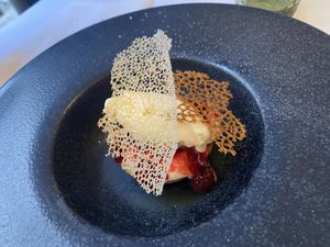 Chocolate terrine accompanied by mango, pineapple, and banana ice cream.  at Brocoli in Lyon