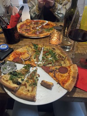 A mix of the carbonara, pepperoni, chicken and salami pizza  at Vegan Pizza Bar in The Hague