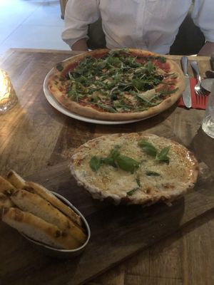 Gnocchi melanzana and a pizza with artichokes and olives  at Vegan Pizza Bar in The Hague