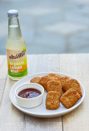 Homemade Vegan, Gluten free Nugget served with BBQ sauce at Green Earth in Dubai