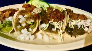 From left to right, Peppers, cactus, and two mushroom tacos topped with the fixings. at Taquería Los Arbolitos in San Francisco