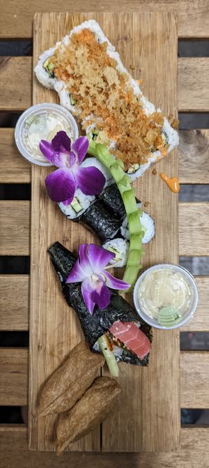 Crunchy Salmon, Cucumber, Hand Roll, Inari Nigiri (top to bottom) at The Sushi Samurai - Queen Anne in Seattle