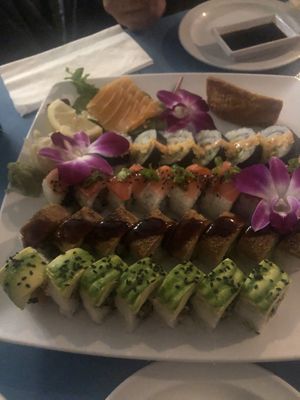 From top left: salmon sashimi, inari nigiri, Maui roll, Seattle roll, dragon roll, and goddess roll  at The Sushi Samurai - Queen Anne in Seattle