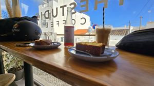 Banana bread, Orange cake and iced latte 🩷 at thestudio.coffee in Praia Da Luz