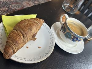 Croissant & Americano  at Encanto - Art Cafe in Helsinki