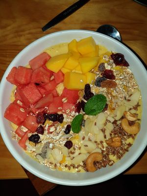 Mango smoothie bowl with granola on top at Vegan Meals in Chiang Mai