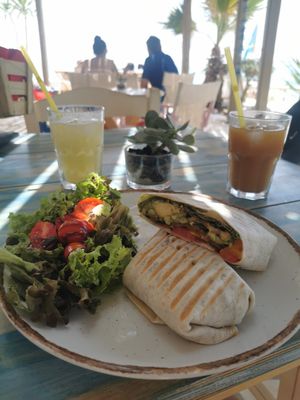 Vegan wrap with peach juice (super sweet) and freshly squeezed lemon juice (super sour) at Seaside Restaurant Bar in Naxos