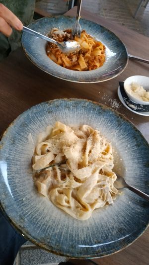 Tagliatelle in creamy sauce with vegan chicken pieces. Tagliatelle in vegan mince tomato sauce. at 11:11 Bistro Bar Healthy Food in Gran Canaria