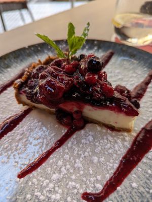 Cheesecake with berries at 11:11 Bistro Bar Healthy Food in Gran Canaria