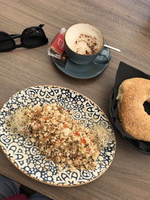 Scrambled Tofu with Bagel and Cappuccino with oatmilk  at 11:11 Bistro Bar Healthy Food in Gran Canaria