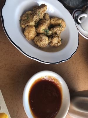 Buffalo cauliflower- (v) breaded and fried then tossed with our homemade Buffalo sauce   at The Witches Brew in West Hempstead