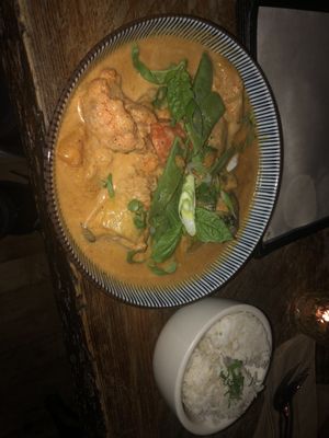 Thai red coconut curry (v) - a spicy vegetable coconut curry garnished with cilantro n scallions served with organic white rice   at The Witches Brew in West Hempstead