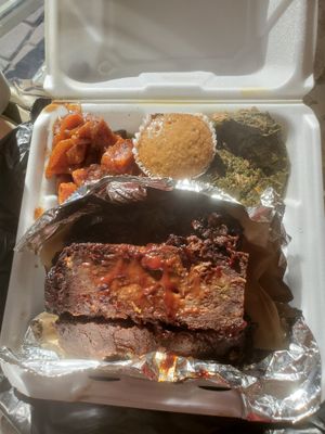 Vegan Meatloaf with sides of glazed yams, greens, and a muffin. at Jack it Up Vegan Eats in Rockford