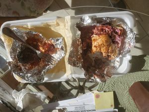 Vegan pulled pork BBQ sandwich with BBQ sauce Cauliflower Wings. So good I ate most of the the wings before thinking of talking a photo! at Jack it Up Vegan Eats in Rockford