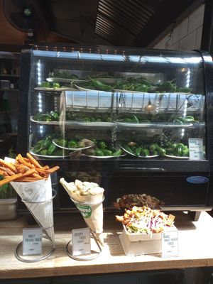 Sweet potato fries, fried vegetables, loaded fries and plenty of plates of Padrón peppers. at Padrón in Amsterdam