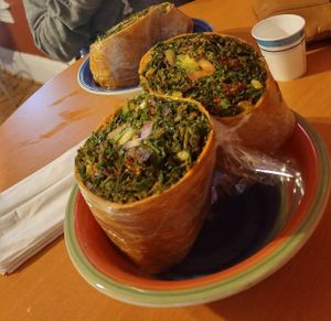 My sister trying a wrap for the firsr time! at Tassili's Raw Reality in Atlanta