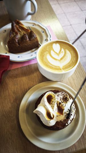 Cappuccino, gluten free orange and chai cupcake, pear pie (blurry). at Crush in Krakow