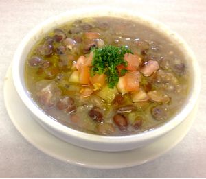 “FOUL” our Fava Beans Dip. With Extra Virgin Olive Oil, Garlic, Lemon and Topped with Diced Tomato / Parsley.  at Alforon in San Diego