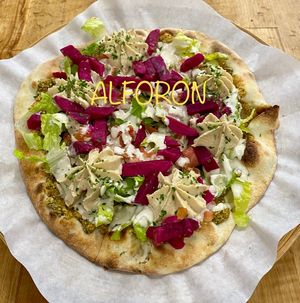 “Falafel Bajeen” Our own exclusive Baked Falafel Flatbread with Humous & all the toppings.  at Alforon in San Diego