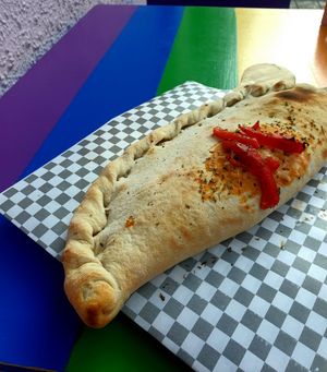 Vegan calzone filled with non-dairy cheese ! Amazing ! at PIZZABELLA in Santiago