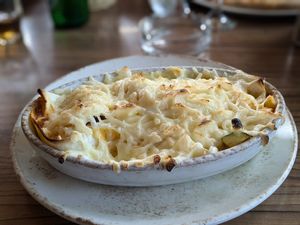 Vegetable tortillas  overbaked with vegan cheese at Motel Majolka in Videm