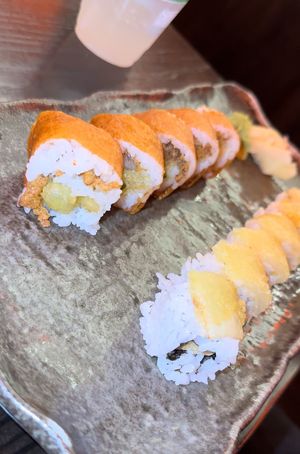 cowgirl (tastes like a cheeseburger 🤯) on the left, and crunchy cabbage (ordered “extra crunchy”)  on the right 😋   at Blue Sushi Sake Grill in Houston