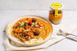 Selma: Couscous base with carrots, walnuts and a touch of lemon, muhammara (red pepper cream), chickpea falafel and cucumber, radish, tomato and mint salad. at The Krass Corner in Tenerife