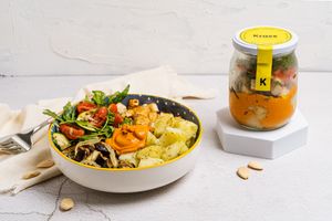 Gobi: Base of roasted potatoes with rosemary, romesco sauce, marinated tofu and rocket salad, eggplant, tomatoes, zucchini and sunflower seeds. at The Krass Corner in Tenerife